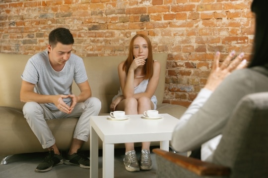 Couples listening to a marriage therapist